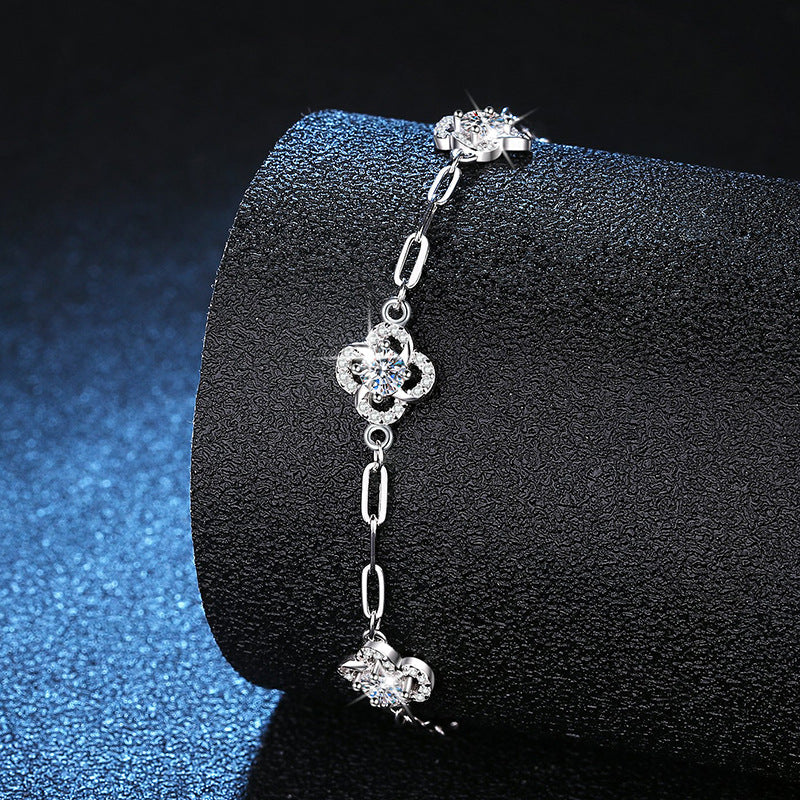 Elegant S925 sterling silver bracelet featuring a blooming flower charm set with a brilliant moissanite stone