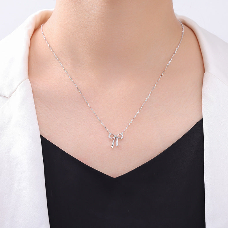 Minimalist S925 sterling silver bowknot pendant necklace featuring a delicate ribbon design for a romantic look