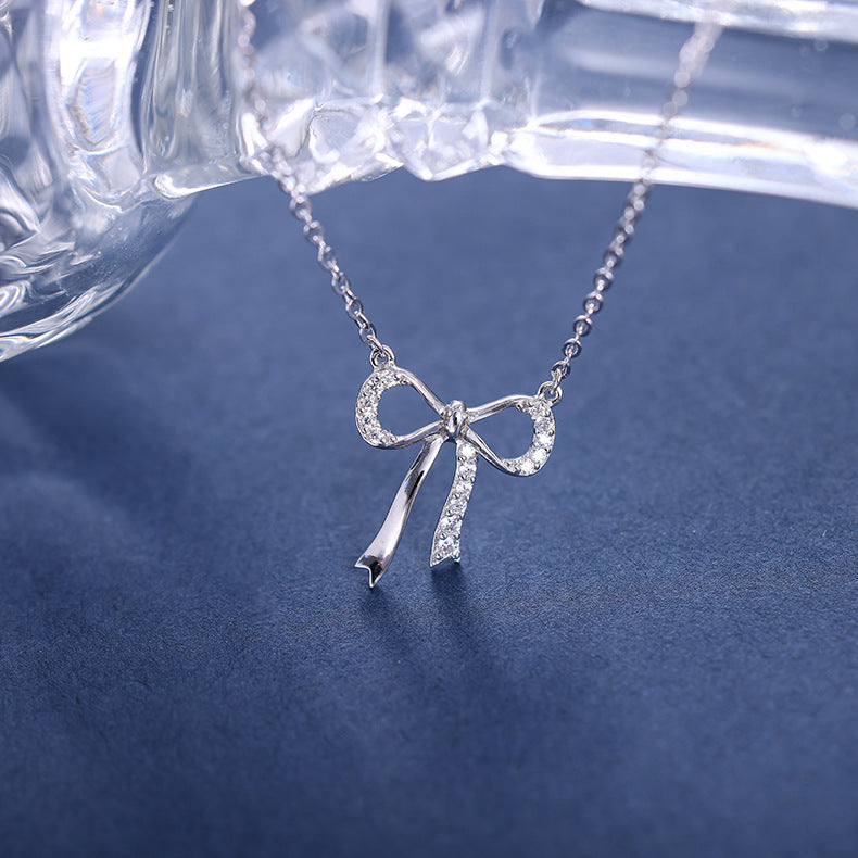 Minimalist S925 sterling silver bowknot pendant necklace featuring a delicate ribbon design for a romantic look
