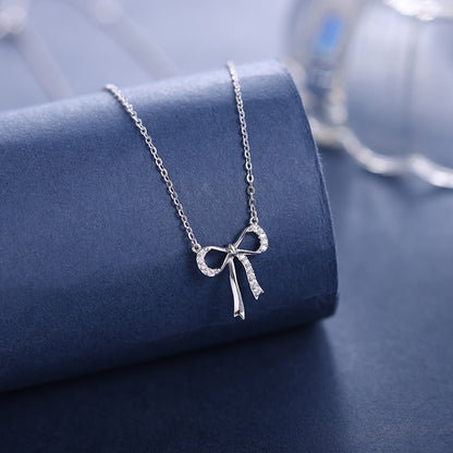 Minimalist S925 sterling silver bowknot pendant necklace featuring a delicate ribbon design for a romantic look