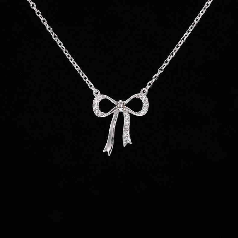 Minimalist S925 sterling silver bowknot pendant necklace featuring a delicate ribbon design for a romantic look