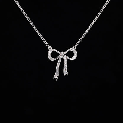 Minimalist S925 sterling silver bowknot pendant necklace featuring a delicate ribbon design for a romantic look