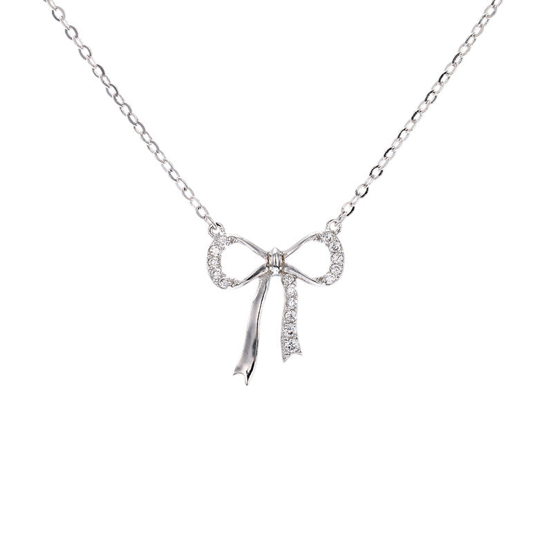 Minimalist S925 sterling silver bowknot pendant necklace featuring a delicate ribbon design for a romantic look