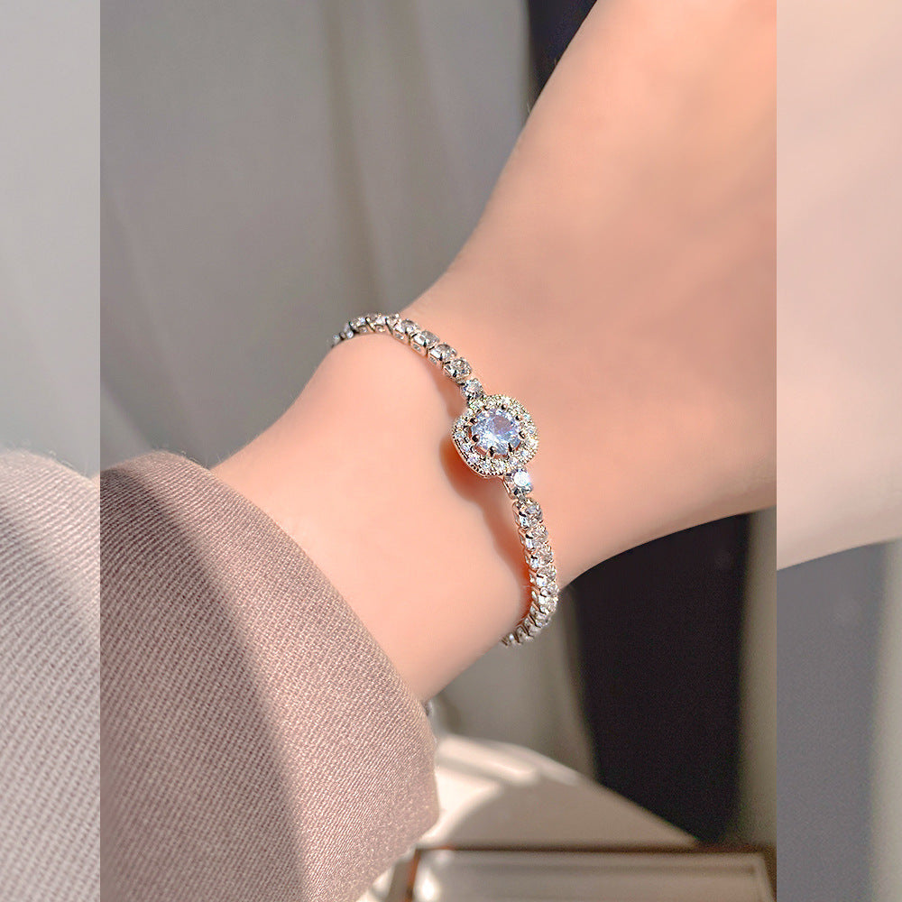 Elegant S925 sterling silver bracelet featuring a round halo design with sparkling white cubic zirconia