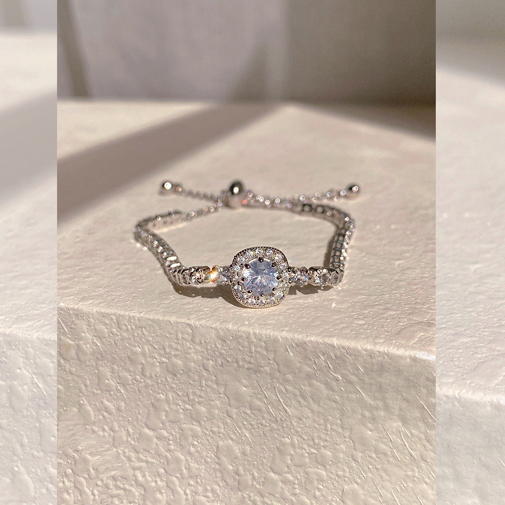 Elegant S925 sterling silver bracelet featuring a round halo design with sparkling white cubic zirconia