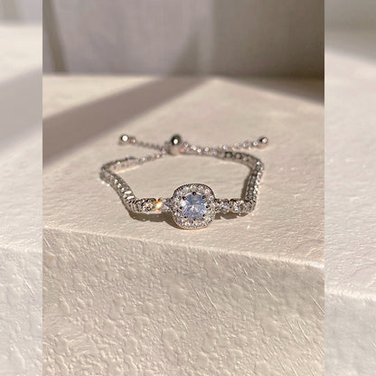 Elegant S925 sterling silver bracelet featuring a round halo design with sparkling white cubic zirconia
