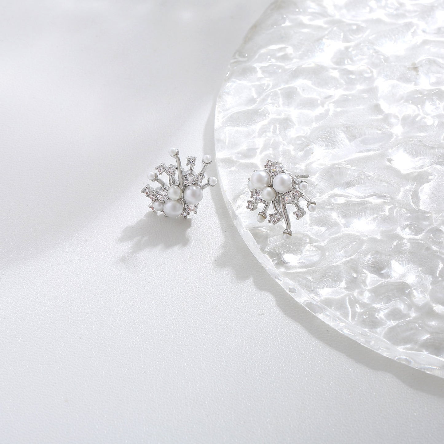 S925 sterling silver drop earrings featuring a sparkling round zirconia stud and a dangling lustrous white pearl
