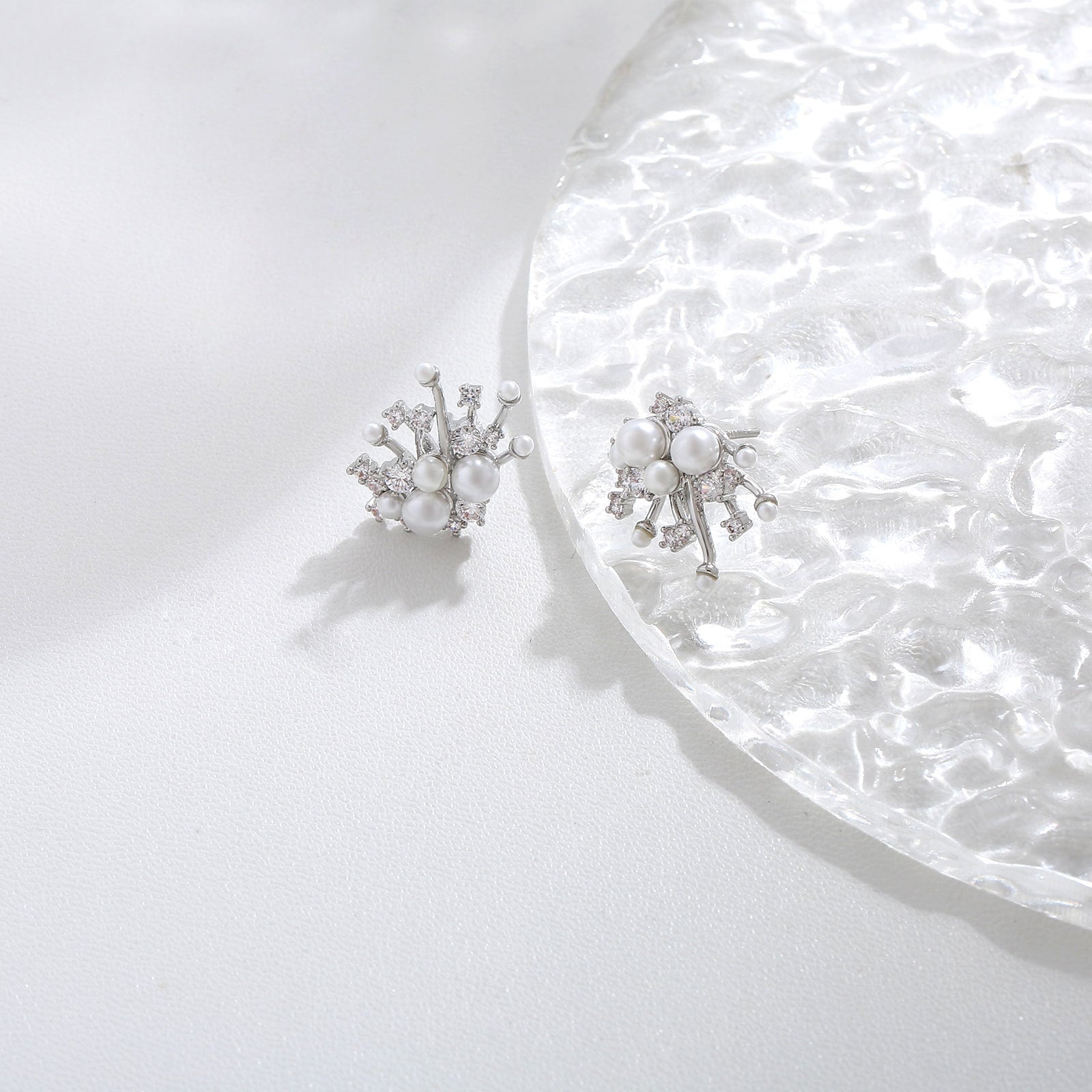 S925 sterling silver drop earrings featuring a sparkling round zirconia stud and a dangling lustrous white pearl