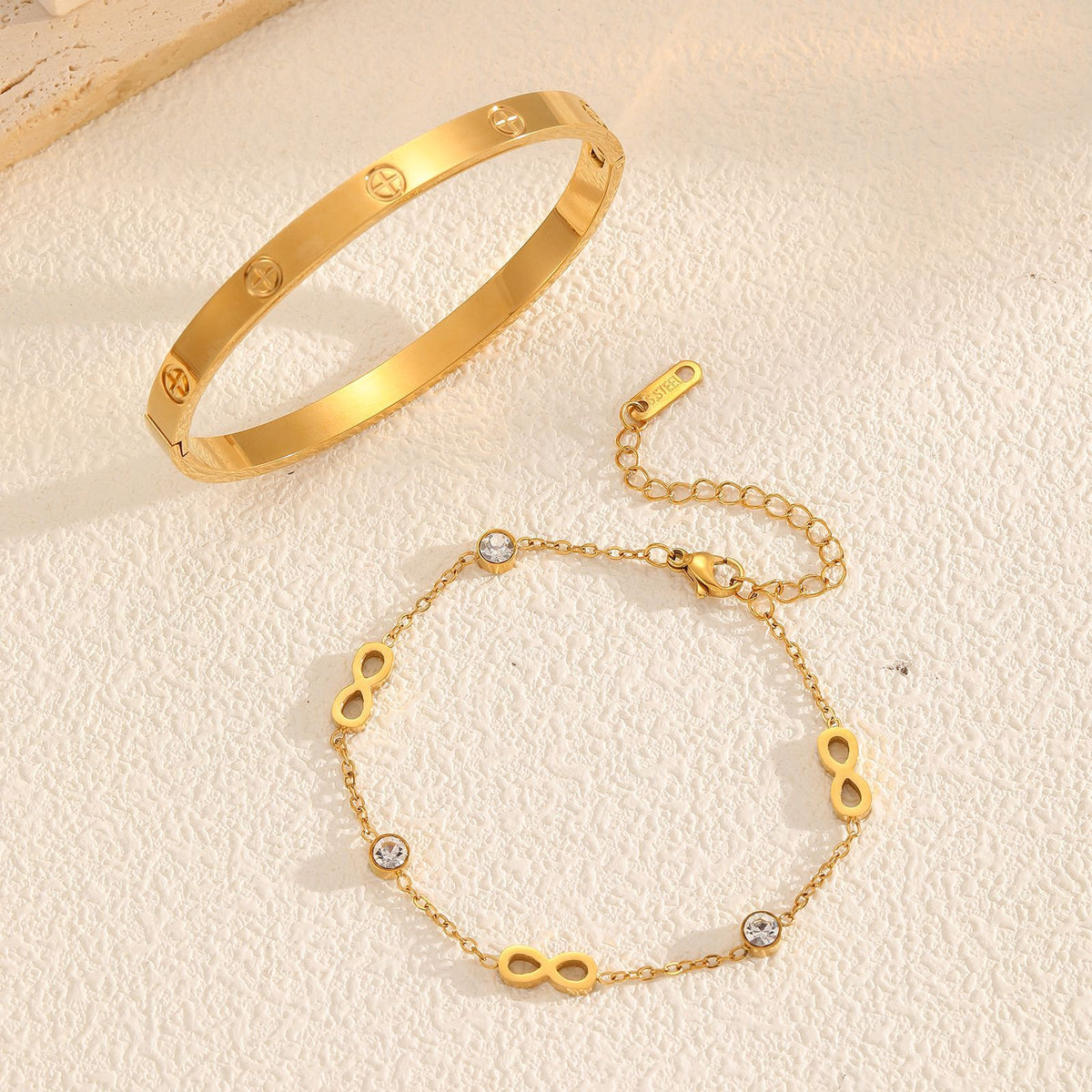 Classic engraved screw motif hinged cuff bangle in waterproof 18k gold plated stainless steel jewelry.