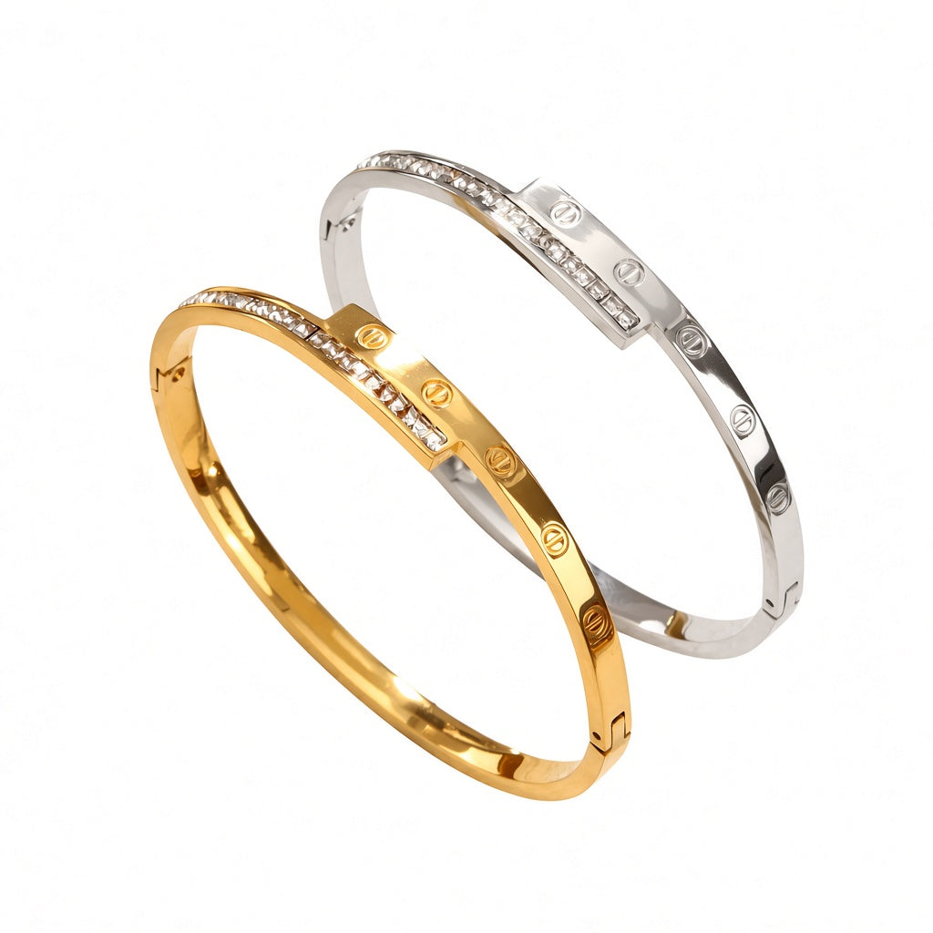 Engraved screw motif and channel-set cubic zirconia T-bar hinged cuff bangle in waterproof 18k gold plated stainless steel jewelry.