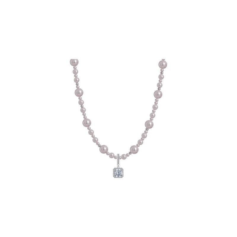 Modern silver-tone necklace featuring a sleek arc pendant with a dangling round pearl and shimmering zircon accents