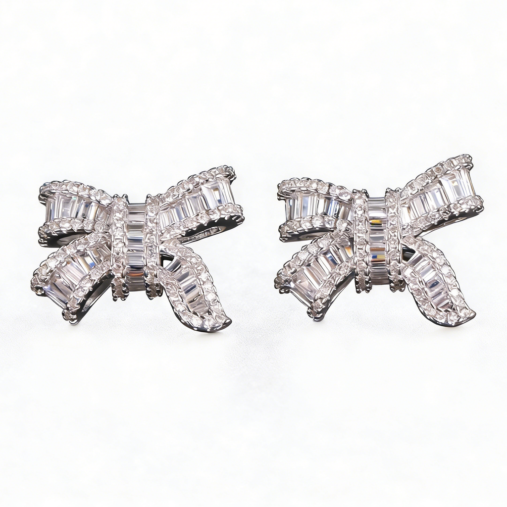 Silver bowknot stud earrings featuring a delicate ribbon design fully set with sparkling clear zirconia stones