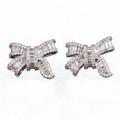 Silver bowknot stud earrings featuring a delicate ribbon design fully set with sparkling clear zirconia stones