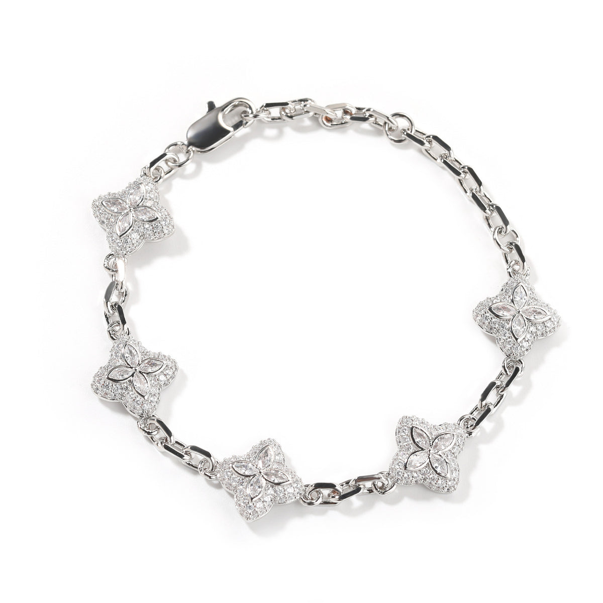 Elegant silver four-leaf clover bangle with pink and green gemstone centers surrounded by a sparkling zirconia halo