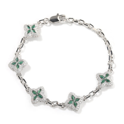 Elegant silver four-leaf clover bangle with pink and green gemstone centers surrounded by a sparkling zirconia halo