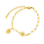 Starburst crystal charms round pearl bead strand paperclip link chain stainless steel jewelry bracelet in waterproof 18k gold plated finish.