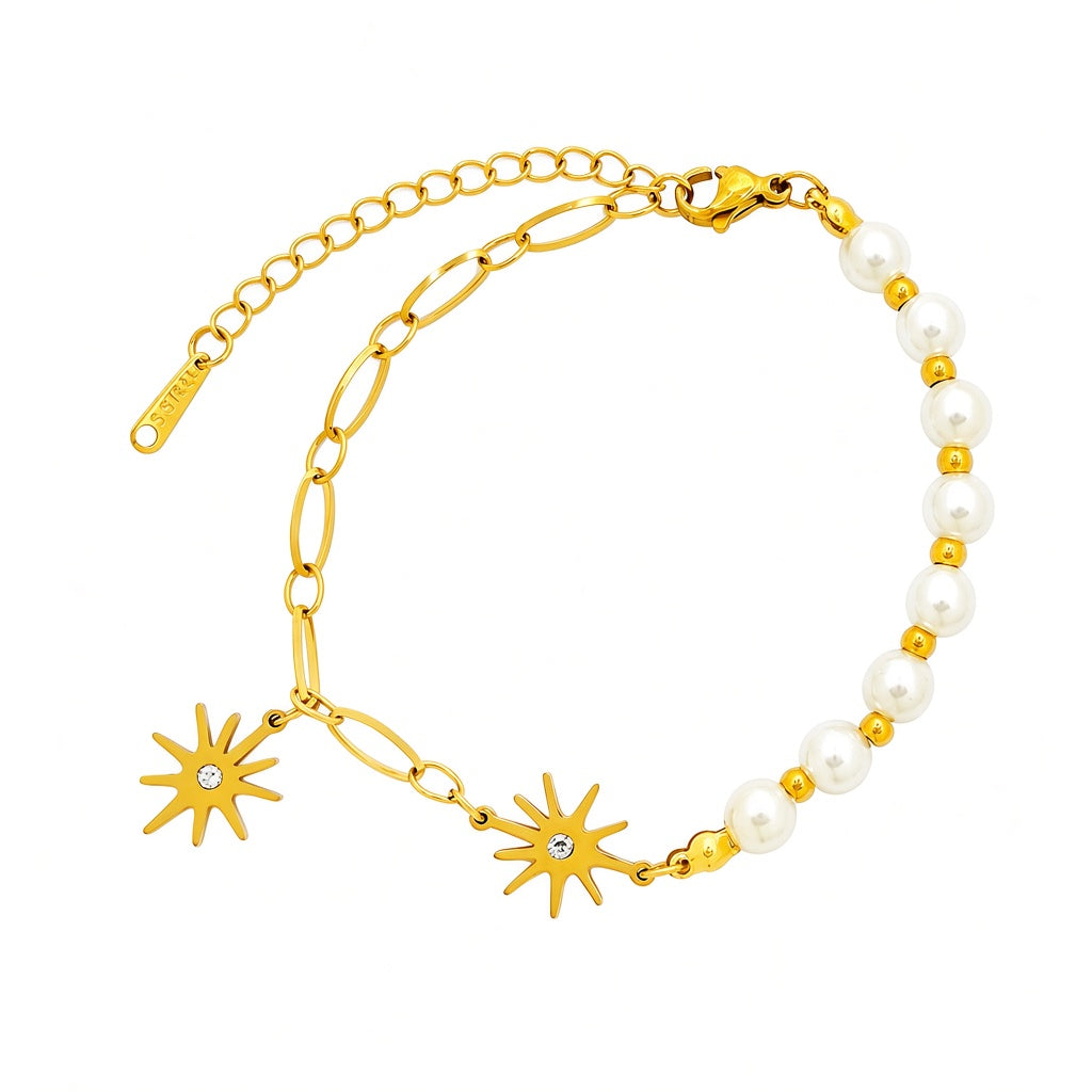 Starburst crystal charms round pearl bead strand paperclip link chain stainless steel jewelry bracelet in waterproof 18k gold plated finish.