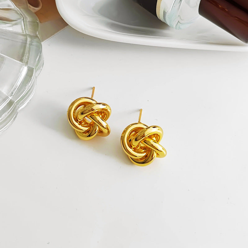 Bold gold  Stainless steel jewelry multi-strand interwoven love knot stud earrings with hollow woven texture.