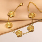 Engraved heart and bezel-set cubic zirconia hinged cuff bangle in waterproof 18k gold plated stainless steel jewelry.