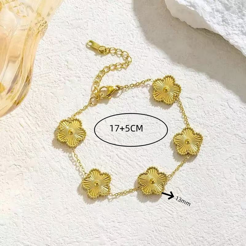 Textured golden flower station link chain bracelet in waterproof 18k gold plated titanium steel jewelry.