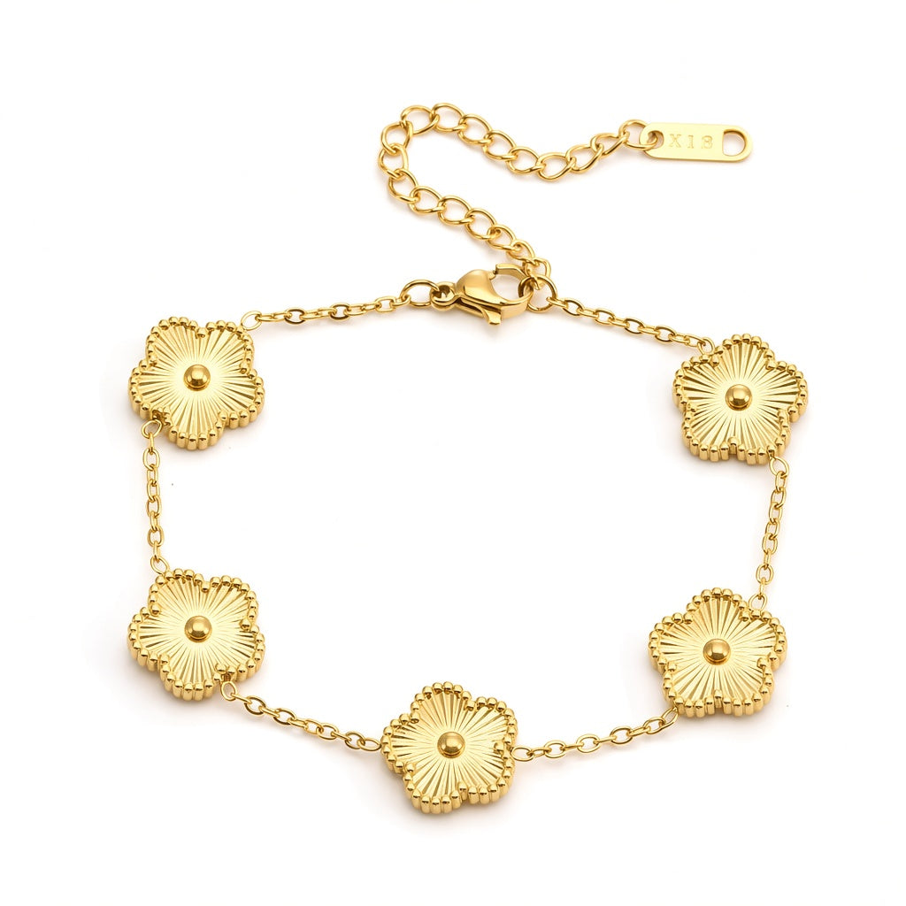 Engraved heart and bezel-set cubic zirconia hinged cuff bangle in waterproof 18k gold plated stainless steel jewelry.