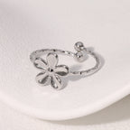 Textured open cuff floral band with flower motif stainless steel jewelry ring in waterproof 18k gold plated finish.