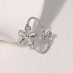 Textured open cuff floral band with flower motif stainless steel jewelry ring in waterproof 18k gold plated finish.