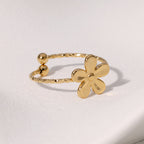 Textured open cuff floral band with flower motif stainless steel jewelry ring in waterproof 18k gold plated finish.