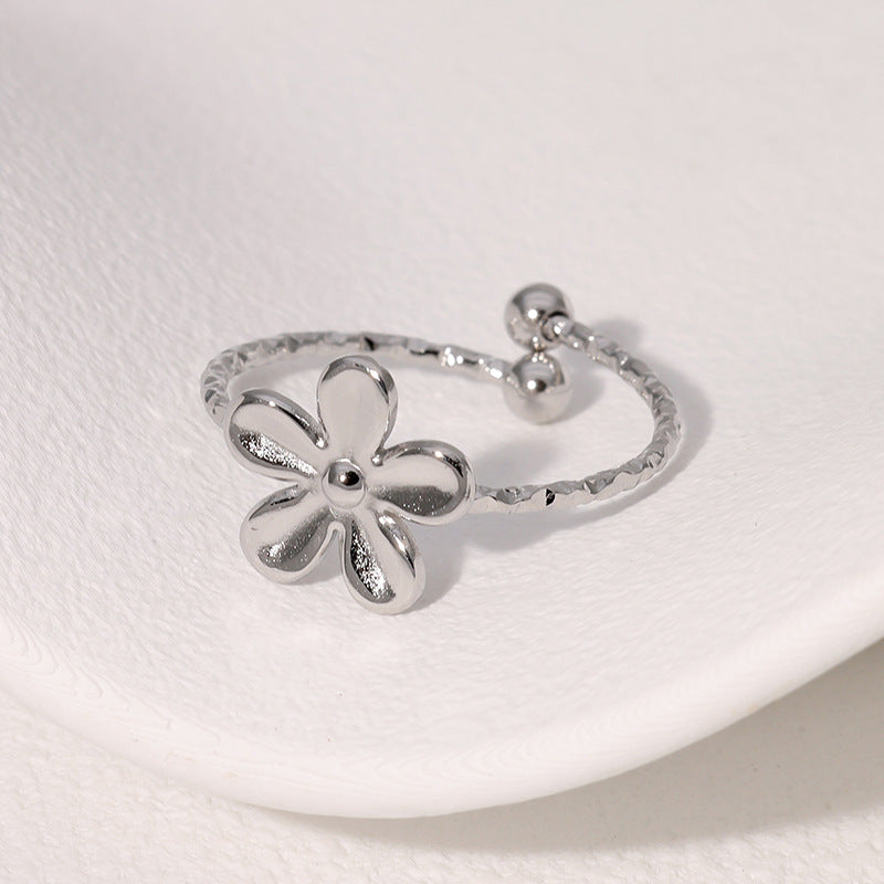 Textured open cuff floral band with flower motif stainless steel jewelry ring in waterproof 18k gold plated finish.