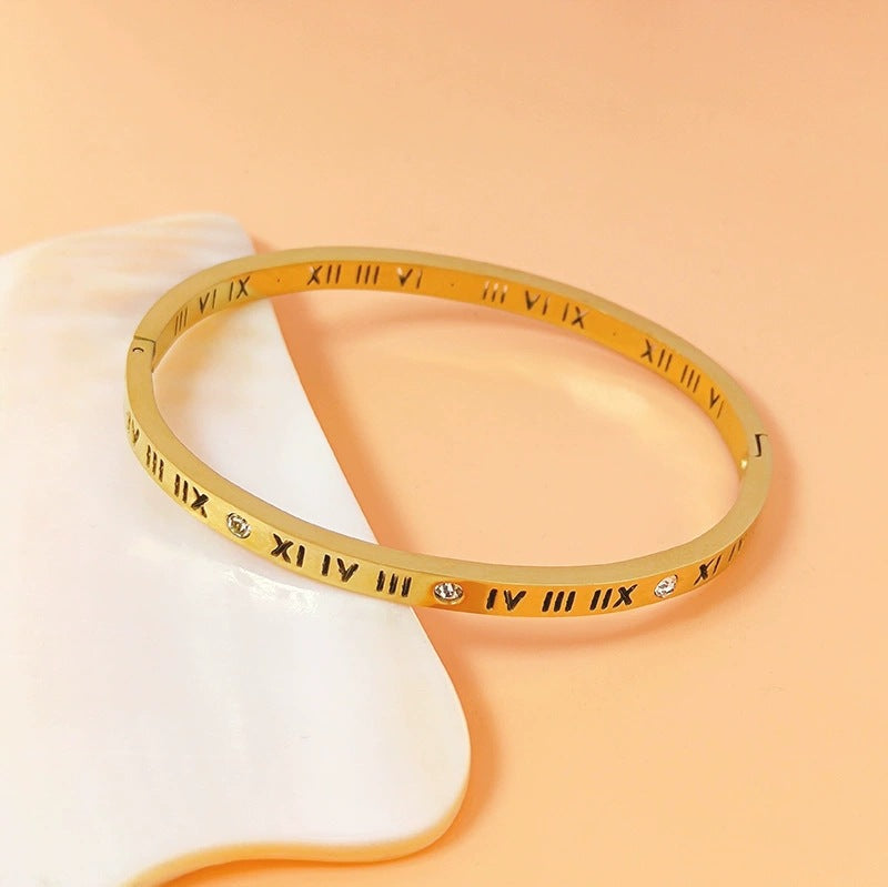 Vintage roman numeral engrave bangle with crystal accents in 18k gold plated titanium steel jewelry.