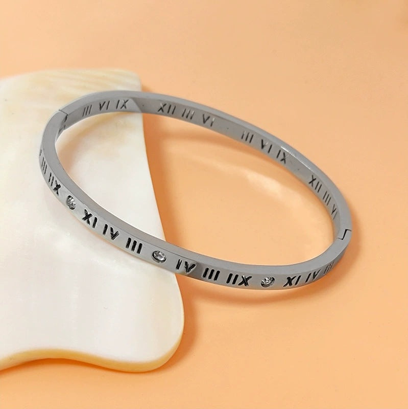 Vintage roman numeral engrave bangle with crystal accents in 18k gold plated titanium steel jewelry.