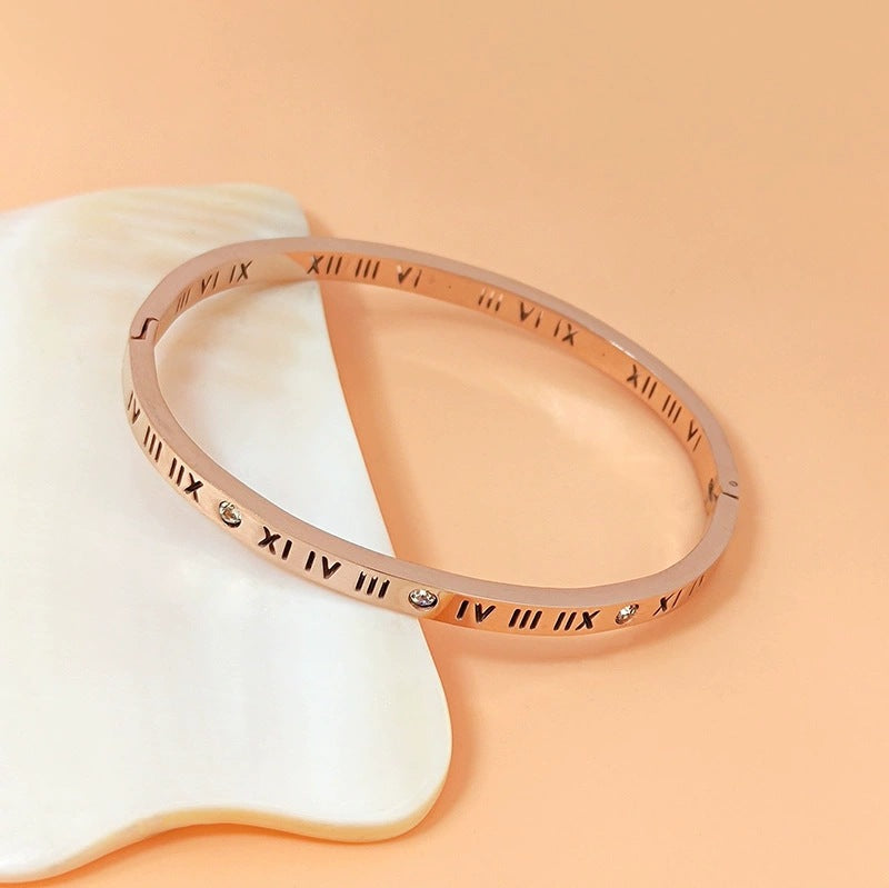 Vintage roman numeral engrave bangle with crystal accents in 18k gold plated titanium steel jewelry.
