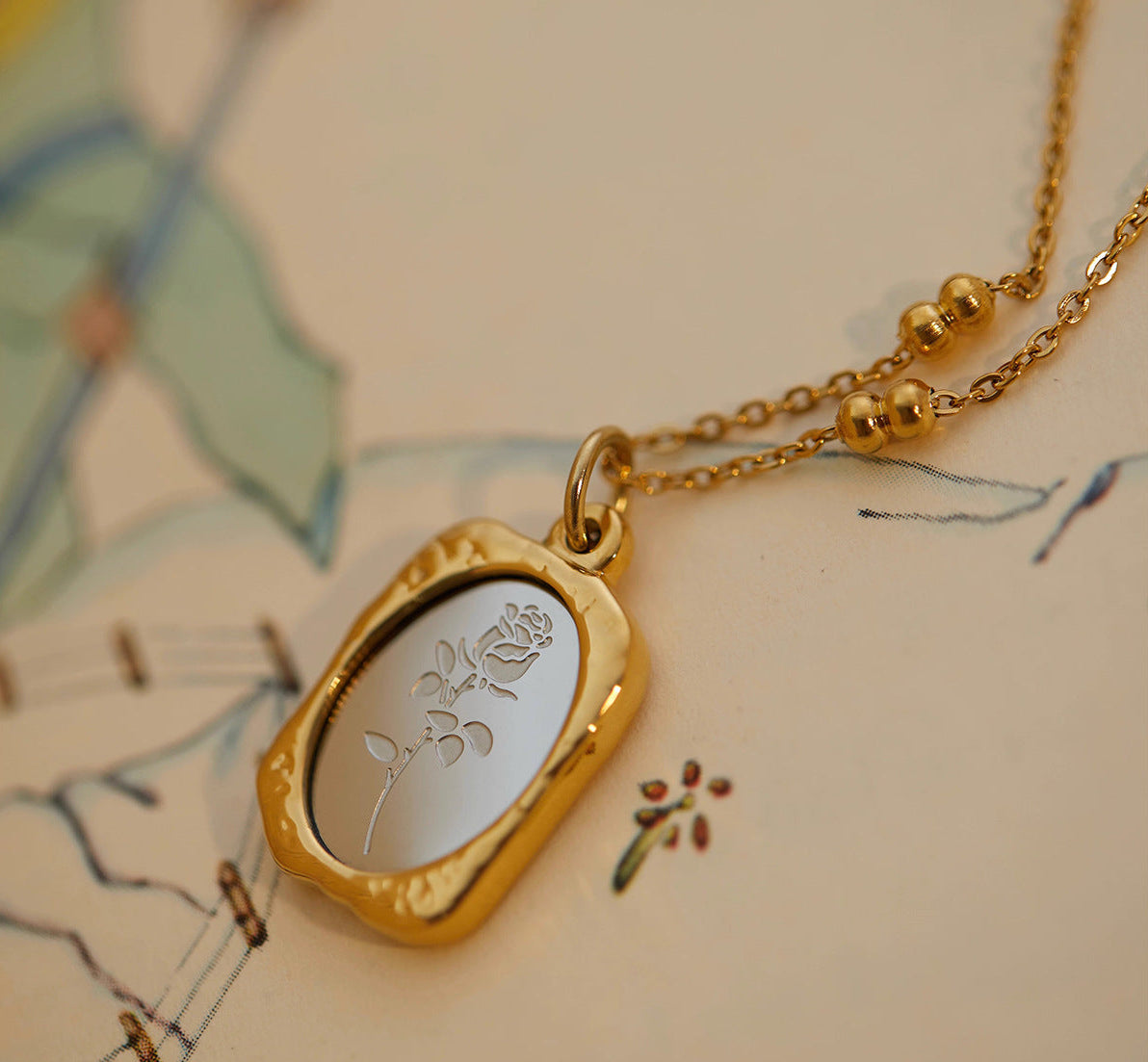 Vintage smoky rose mirror relief pendant bead station chain necklace in 18k gold plated jewelry.
