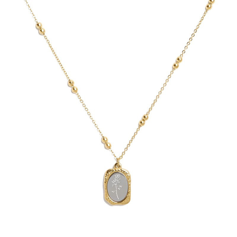 Vintage smoky rose mirror relief pendant bead station chain necklace in 18k gold plated jewelry.
