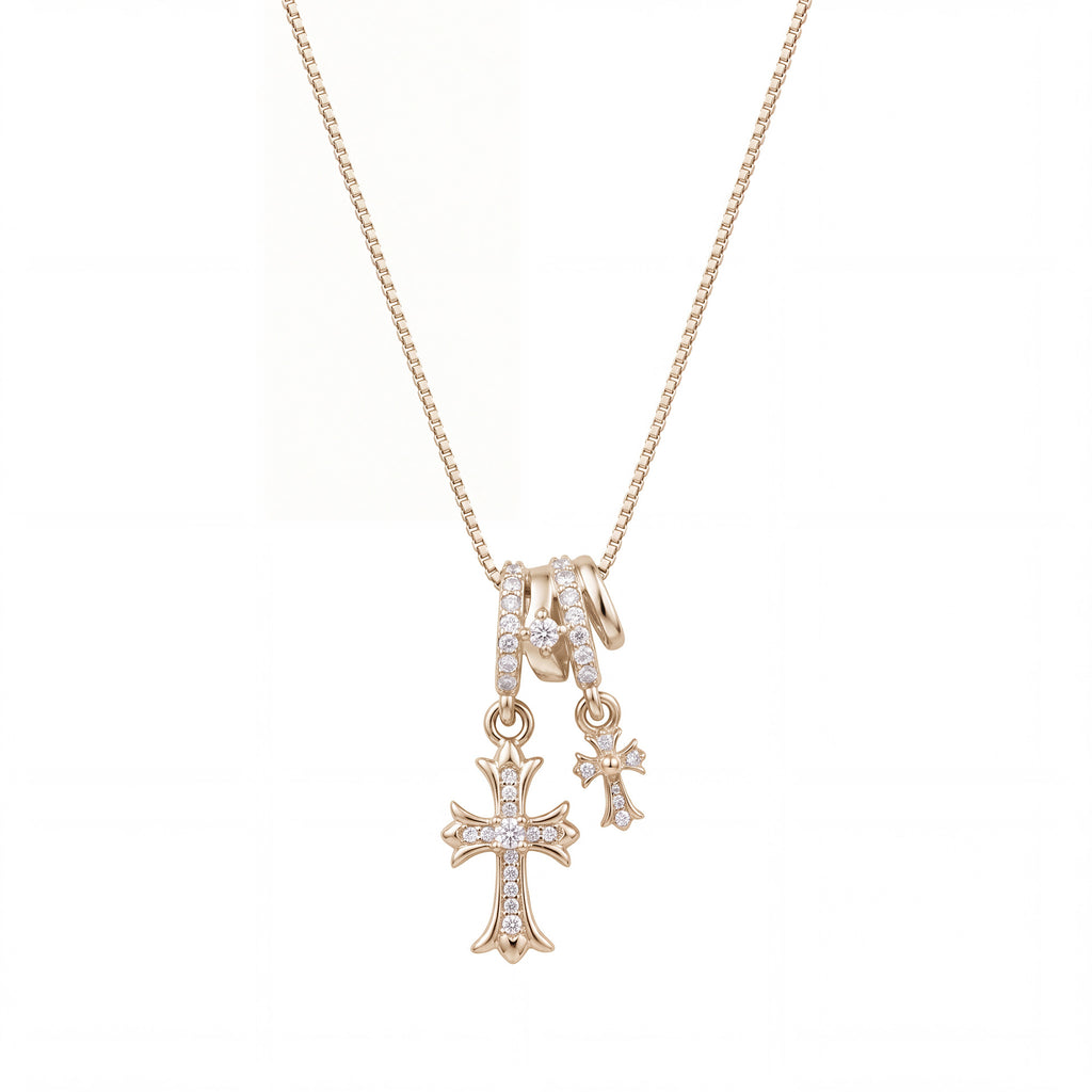 Waterproof stainless steel jewelry collection featuring champagne gold hypoallergenic gold plated double cross CZ pave pendant necklace.