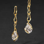 Waterproof stainless steel jewelry collection featuring hypoallergenic gold plated CZ pave teardrop long chain drop earrings with S925 posts