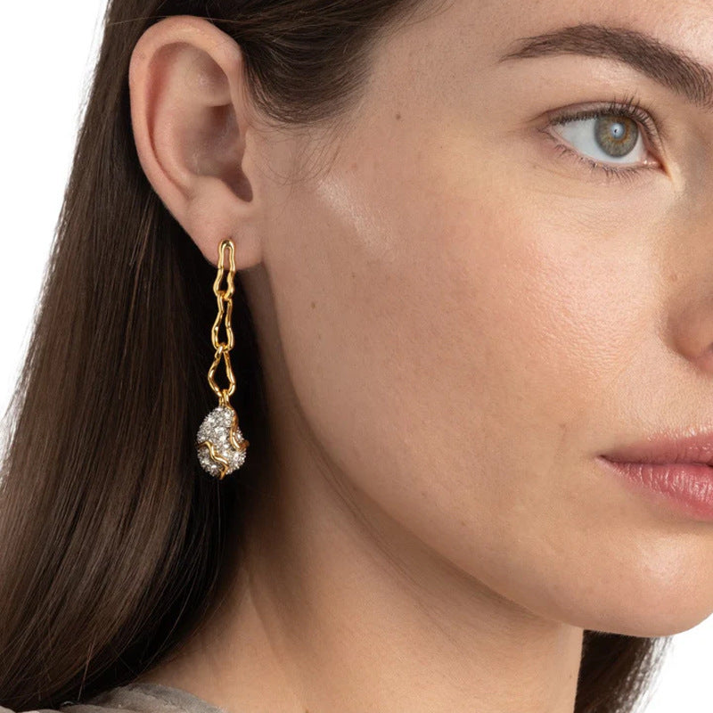 Waterproof stainless steel jewelry collection featuring hypoallergenic gold plated CZ pave teardrop long chain drop earrings with S925 posts