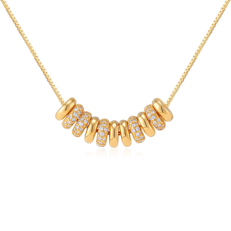 Waterproof stainless steel jewelry collection featuring 18k gold plated disc bead pave crystal tassel pendant necklace