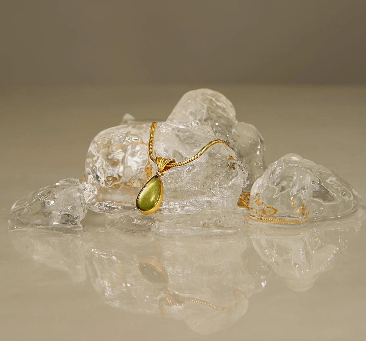 Waterproof stainless steel jewelry collection featuring hypoallergenic gold plated olive green glass teardrop pendant snake chain necklace.