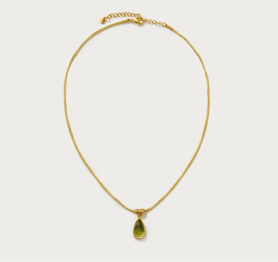 Waterproof stainless steel jewelry collection featuring hypoallergenic gold plated olive green glass teardrop pendant snake chain necklace.