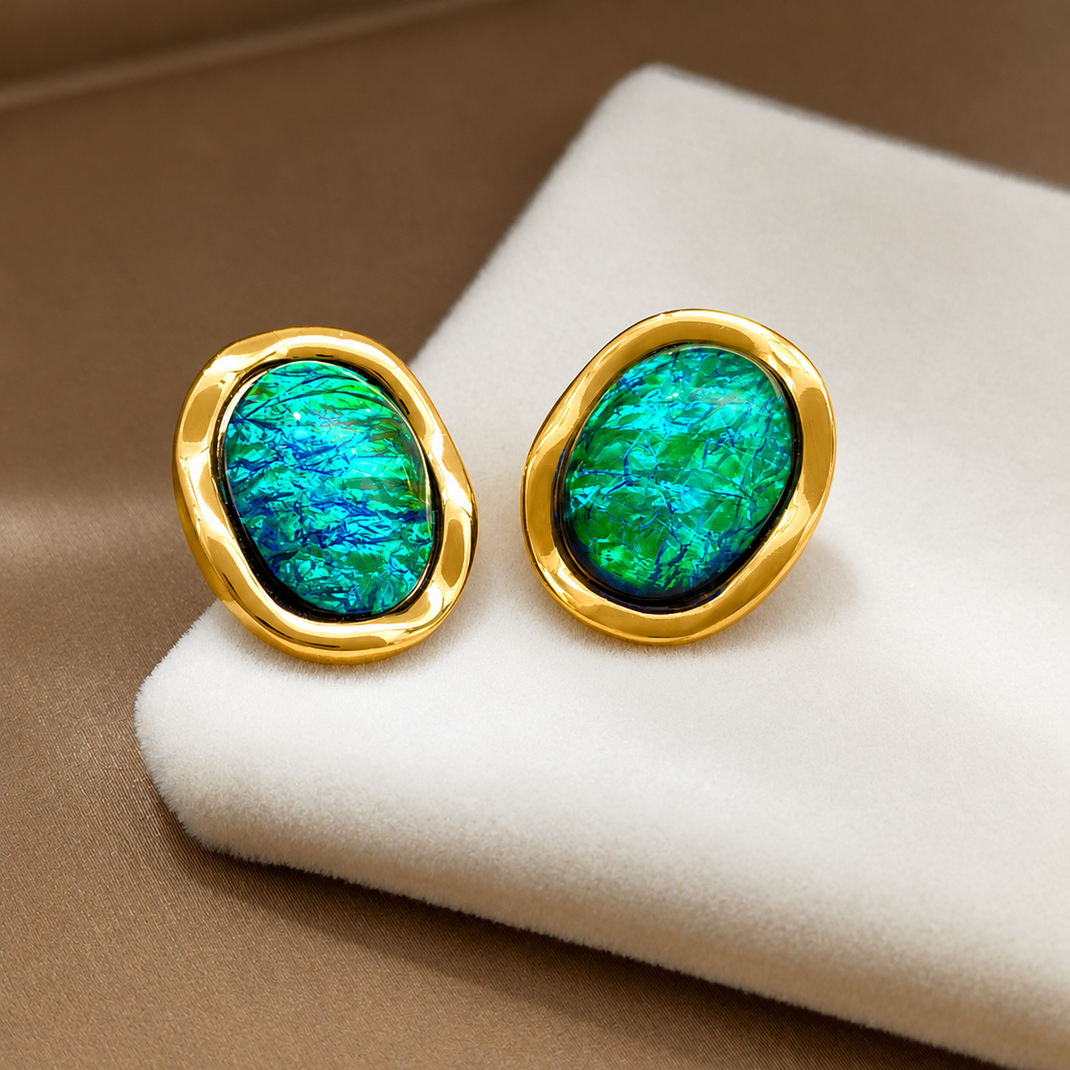 Waterproof stainless steel jewelry collection featuring hypoallergenic gold plated vintage oval emerald green resin stone stud earrings.