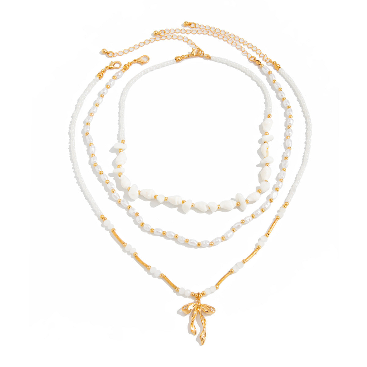 Waterproof stainless steel jewelry collection featuring hypoallergenic gold plated ribbon bow pendant pearl beaded 3-piece layered necklace set.