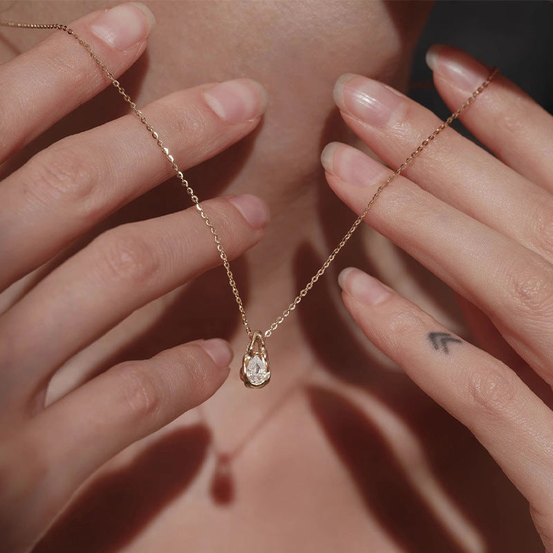 Waterproof stainless steel jewelry collection featuring 18k gold plated molten teardrop crystal pendant necklace.