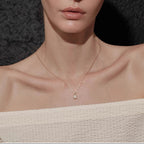 Waterproof stainless steel jewelry collection featuring 18k gold plated molten teardrop crystal pendant necklace.