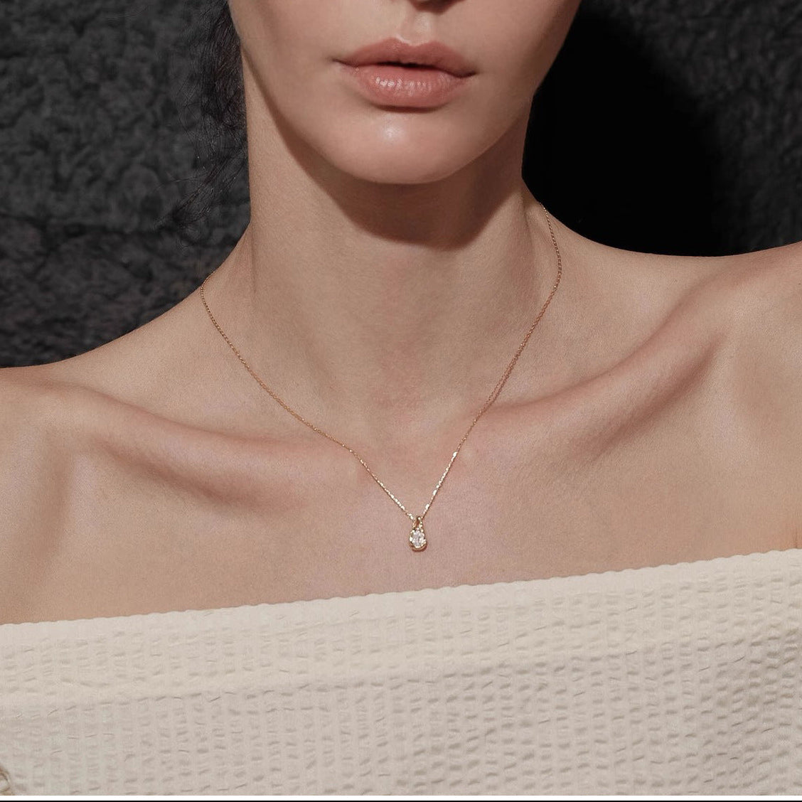 Waterproof stainless steel jewelry collection featuring 18k gold plated molten teardrop crystal pendant necklace.