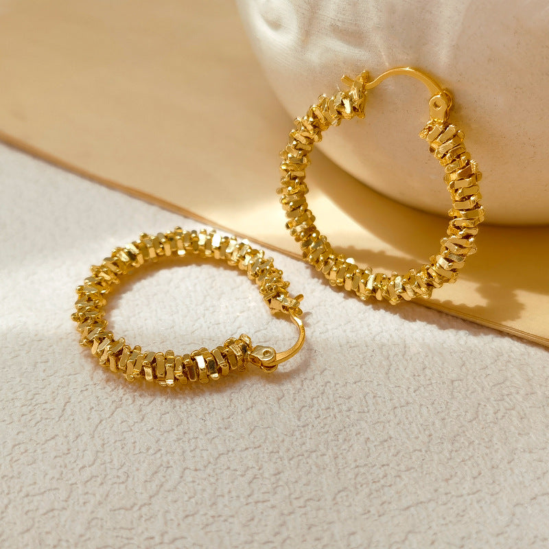 Waterproof stainless steel jewelry collection featuring hypoallergenic gold plated and silver glitter textured hoop earrings