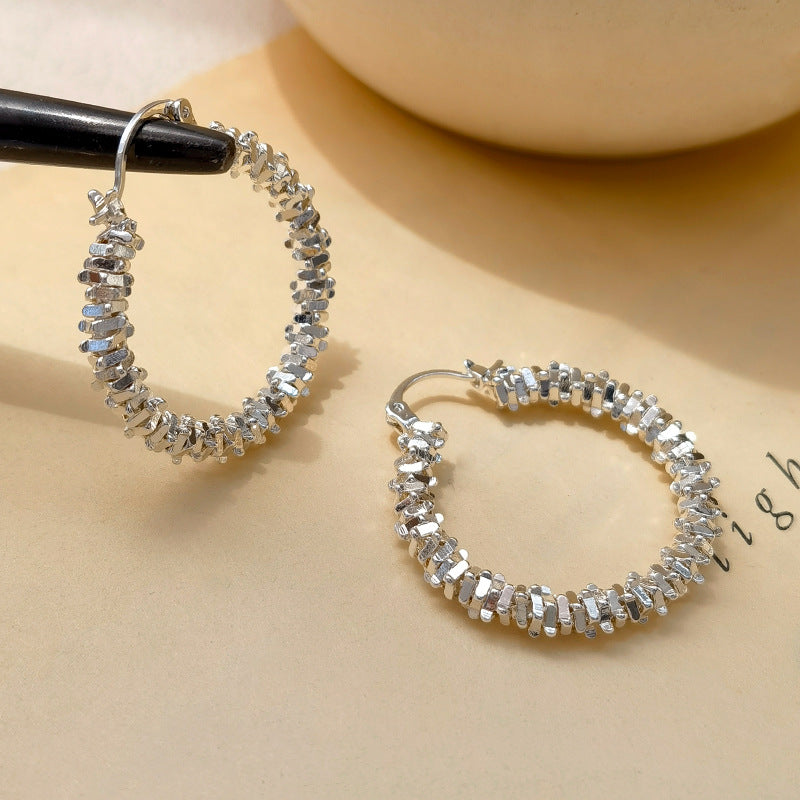 Waterproof stainless steel jewelry collection featuring hypoallergenic gold plated and silver glitter textured hoop earrings