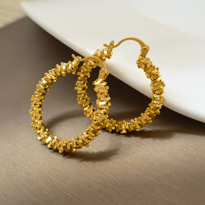 Waterproof stainless steel jewelry collection featuring hypoallergenic gold plated and silver glitter textured hoop earrings