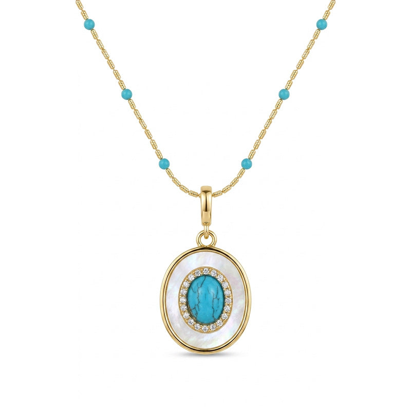 Waterproof stainless steel jewelry collection featuring hypoallergenic gold plated oval turquoise and mother of pearl pendant necklace.